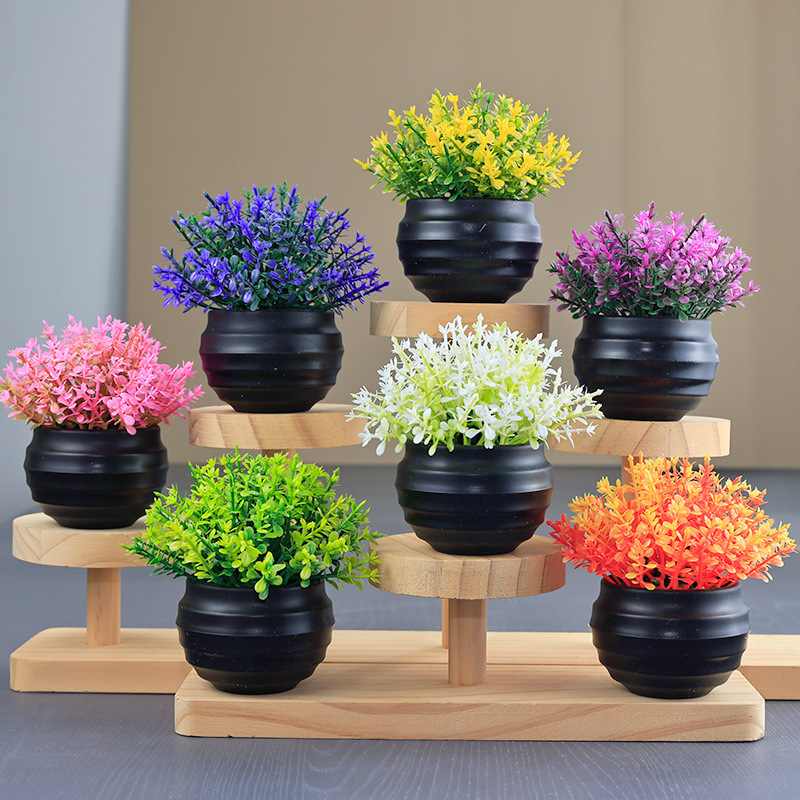 Artificial Eucalyptus plant in a black flower pot