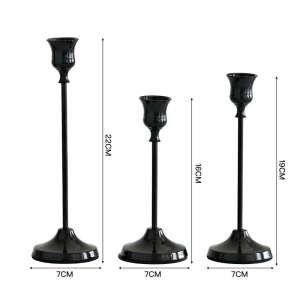 Gold, silver, and black candlestick three-piece set