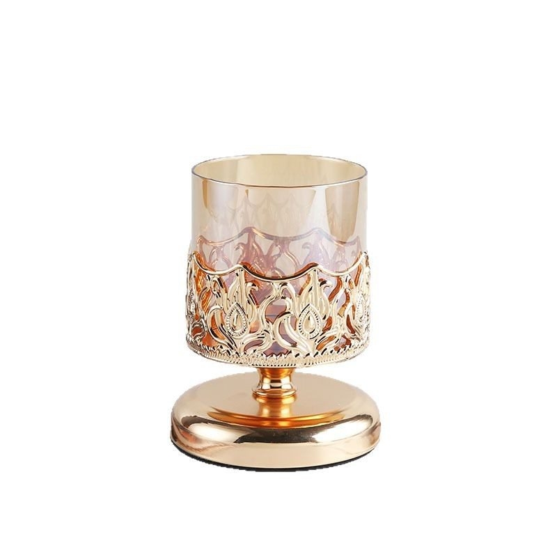 Candlestick made of metal and glass