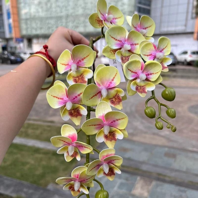 Two branches of artificial butterfly orchids