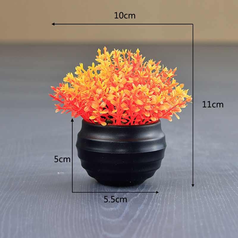 Artificial Eucalyptus plant in a black flower pot