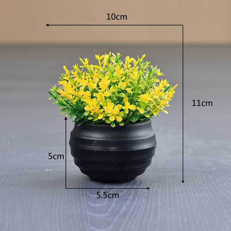 Artificial Eucalyptus plant in a black flower pot