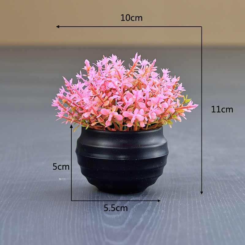 Artificial Eucalyptus plant in a black flower pot