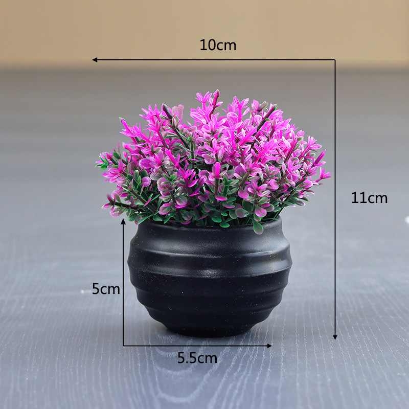 Artificial Eucalyptus plant in a black flower pot