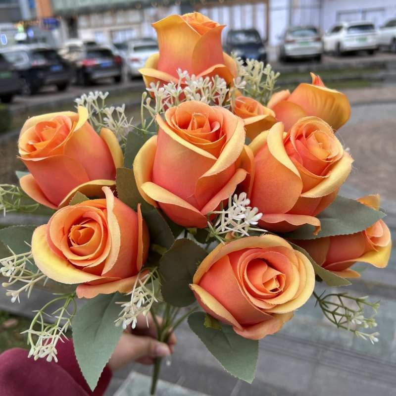 Artificial rosebud with nine blooms